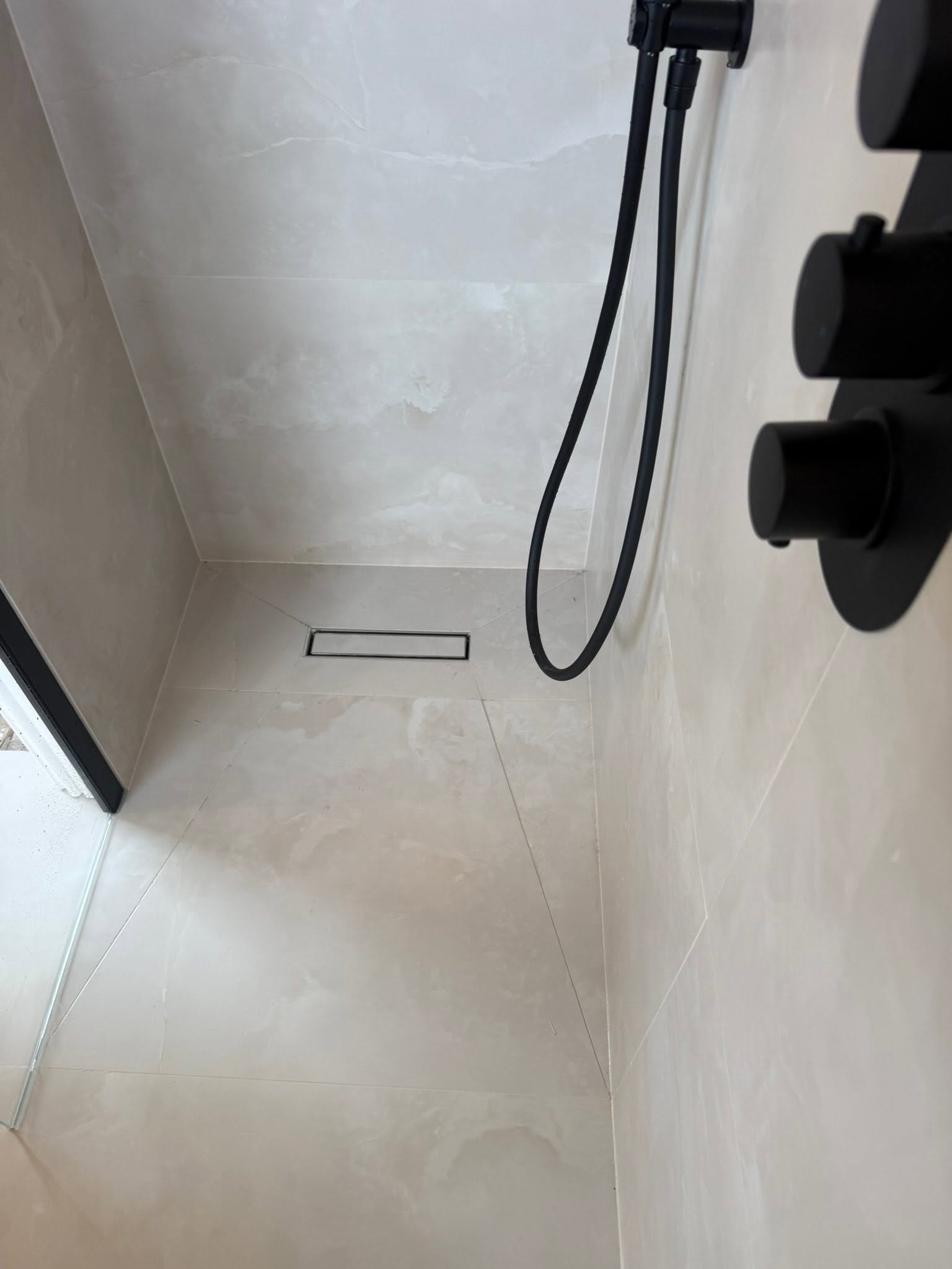 Luxury bathroom fittings — premium tiling and brassware installed in a Blackpool home